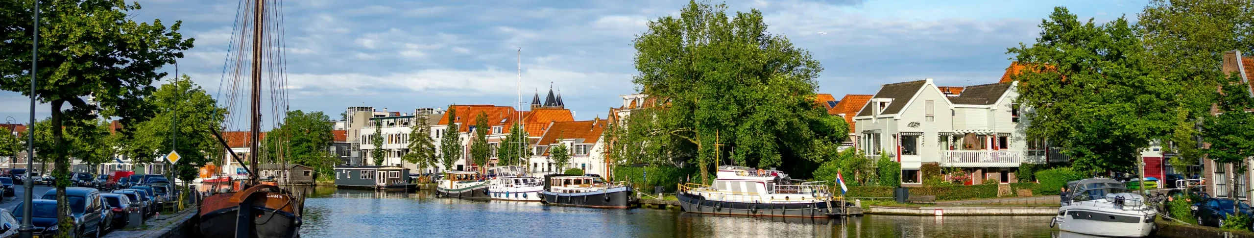 Smidtje Canal Cruises - Open sloep rondvaart door Haarlem hero