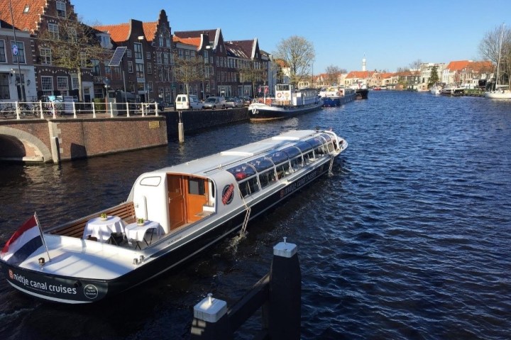 a boat is docked next to a body of water