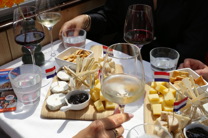 a group of people sitting at a table with wine glasses